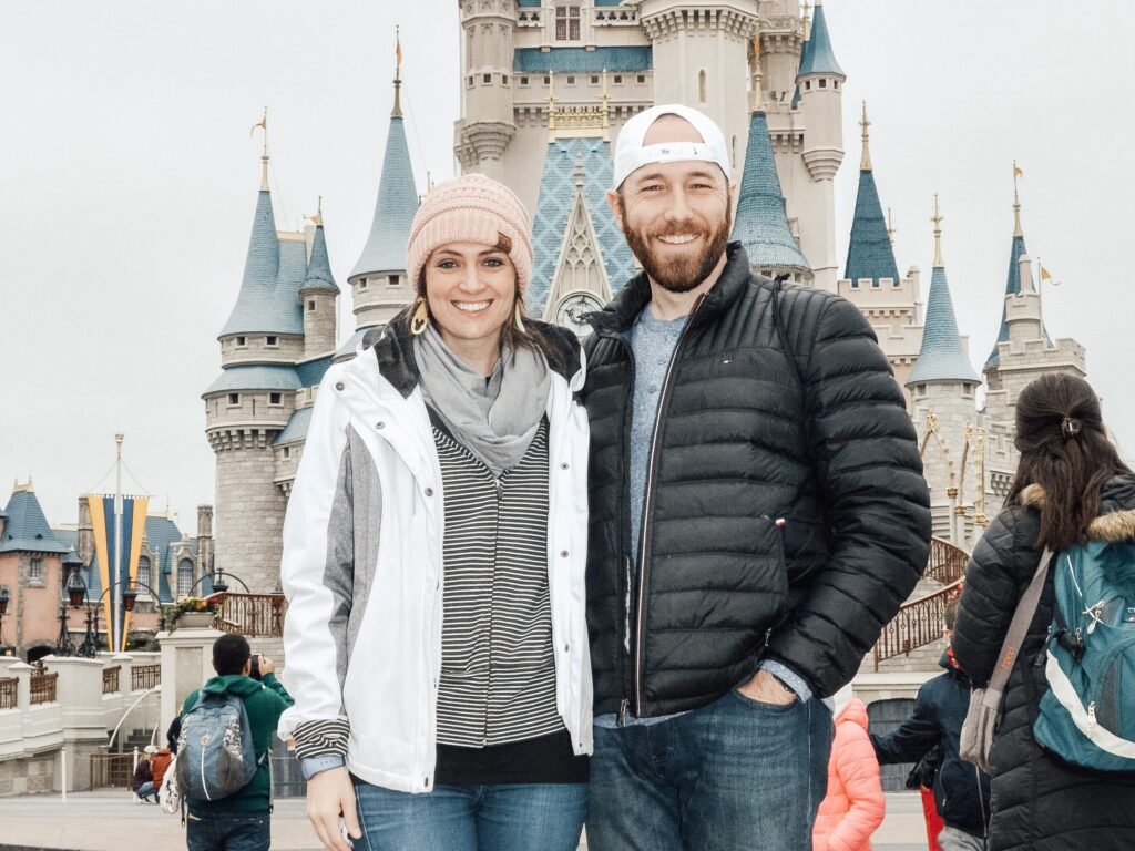 Margy and Kyle at Disney World Magic Kingdom in front of Cinderella Castle