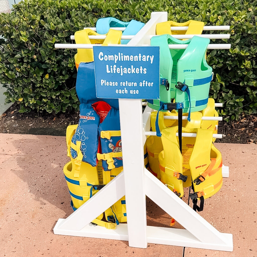 Complimentary Lifejacket Sign with lifejackets on rack