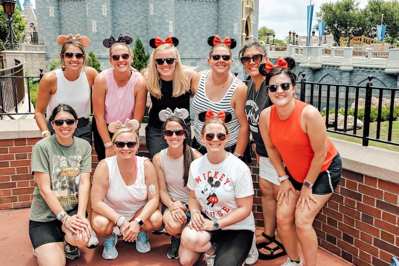 10 Women on Disney World Trip at Magic Kingdom Cinderella's Castle