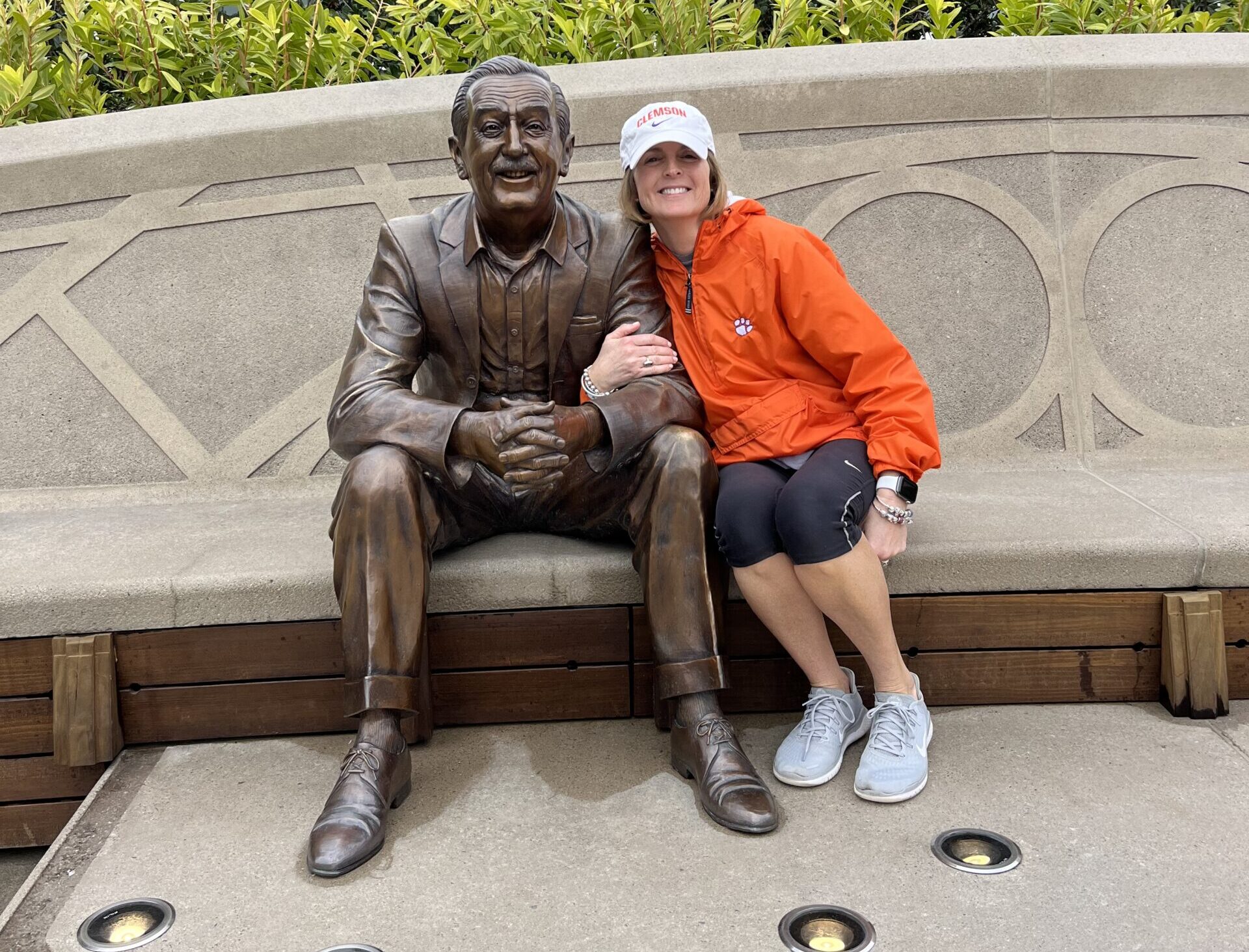 Woman with Walt Disney statue at Epcot