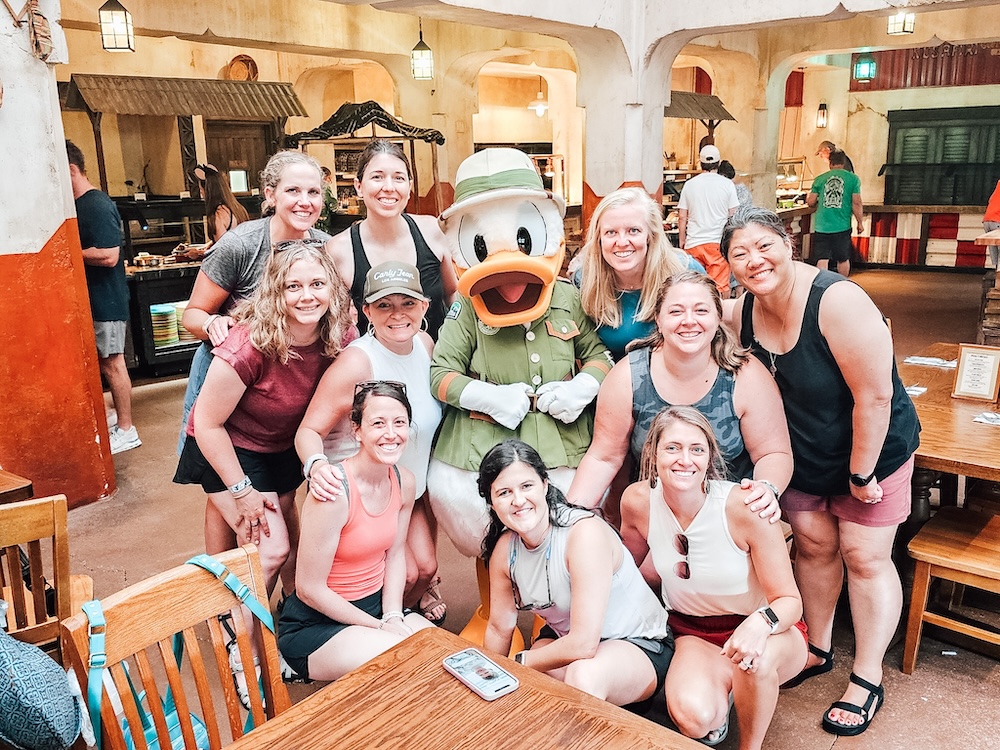 10 Girls with Donald Duck on Disney World Trip at Animal Kingdom's Tusker House