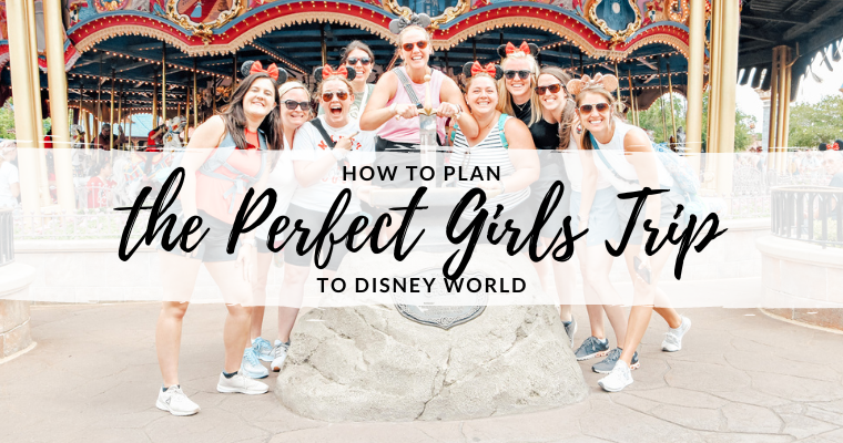 group of women at sword and stone in front of magic kingdom's Prince Charming carousel